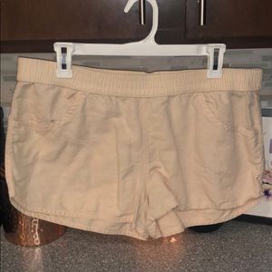 Light elastic banded peach colored shorts